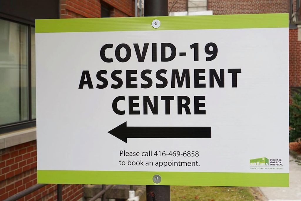 covid cases and vaccine sign