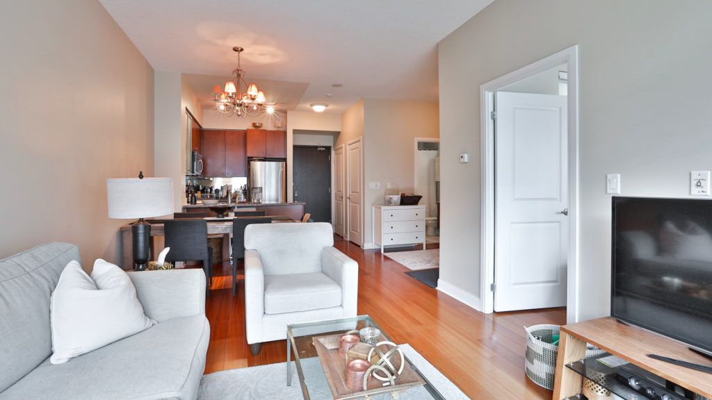 A photo of the living and dining space of the condo.