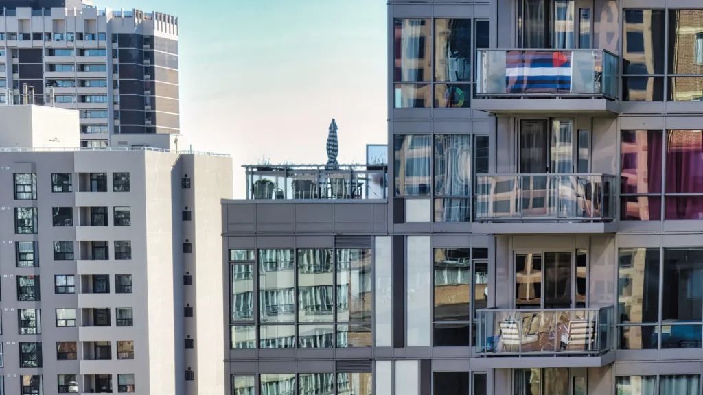 concrete big real estate apartment building in Toronto with a garden around