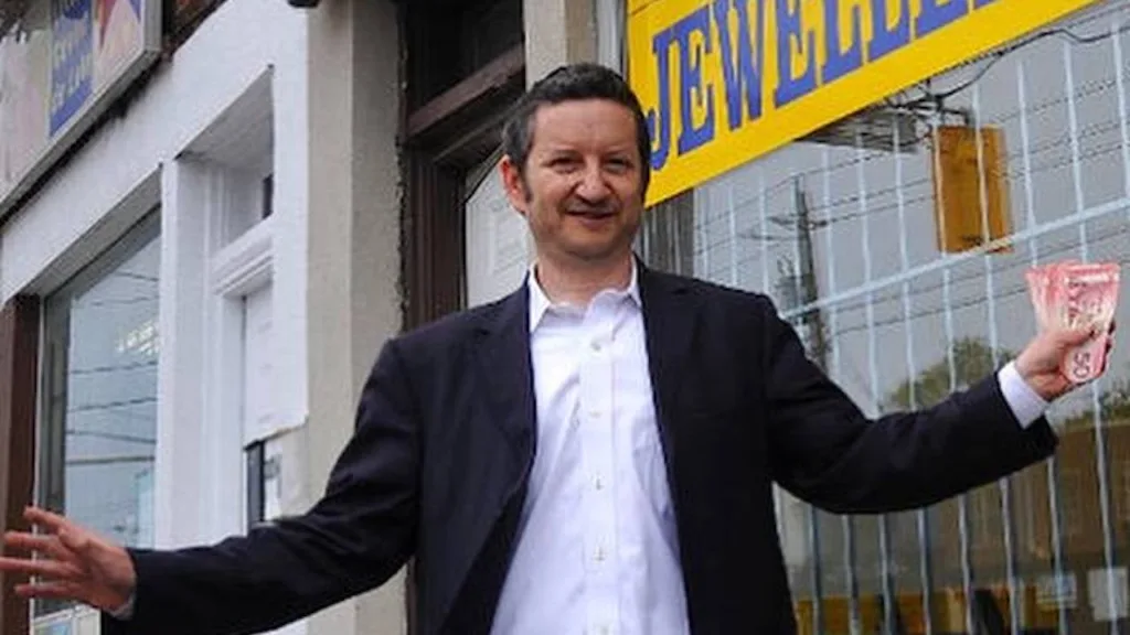 photo of Harold Gerstel in front of Bathurst Street store
